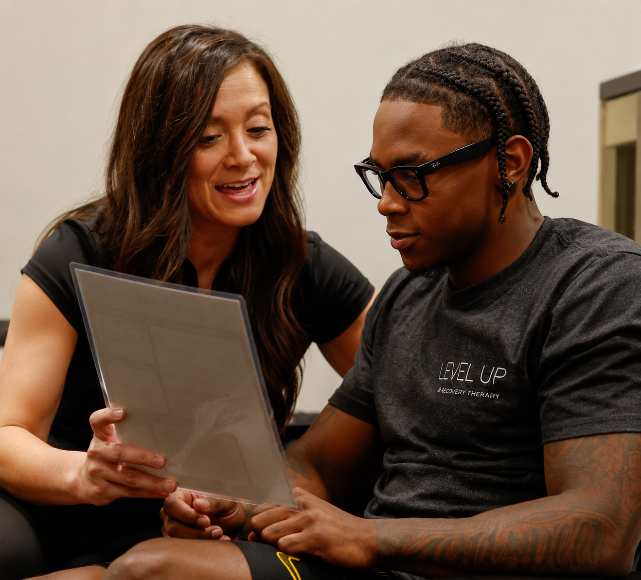 Level Up practitioner reviewing a personalized IV therapy plan with a client